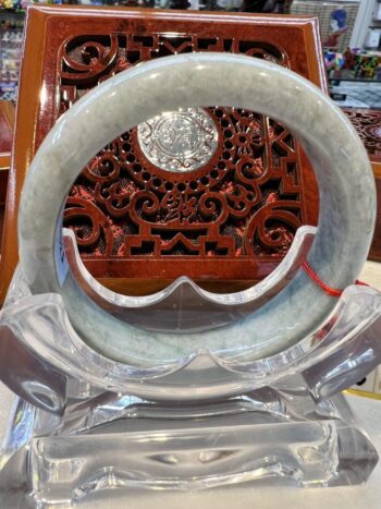 A large circular stone sculpture sitting on top of a table.