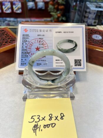 A close up of a display case with a ring