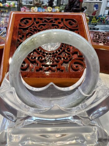 A close up of an asian style table with a glass bowl