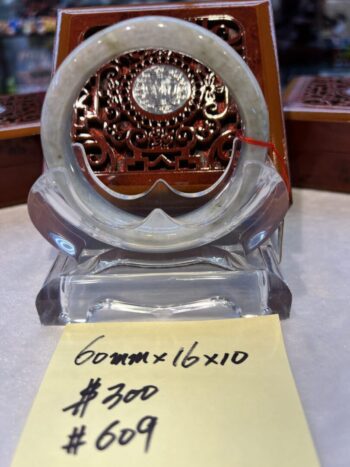 A small clock sitting on top of a table.