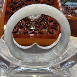 A close up of an asian style table with a white and clear glass bowl.