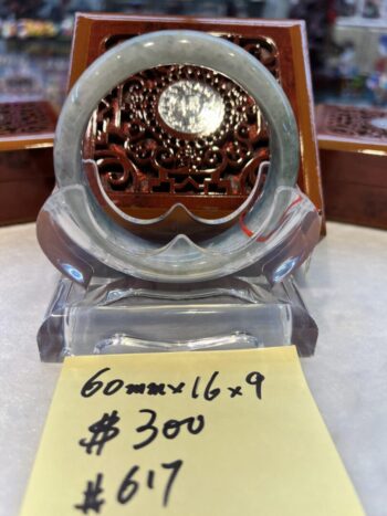 A small clock sitting on top of a table.