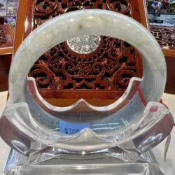 A close up of an asian chair with a glass ring