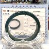 A glass ring sitting on top of a certificate.