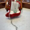 A necklace is sitting in a red box.