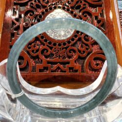 A close up of the inside of an ornate wooden chair.