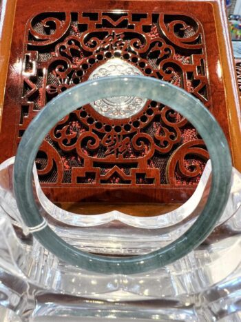 A close up of the inside of an ornate wooden chair.