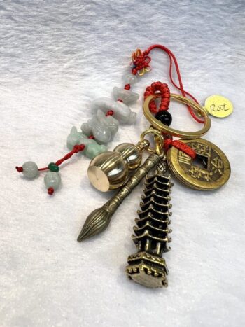 A key chain with various charms and beads.