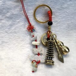 A key chain with some charms and beads on it