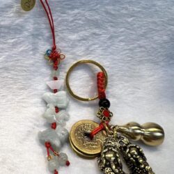 A key chain with some charms and beads on it