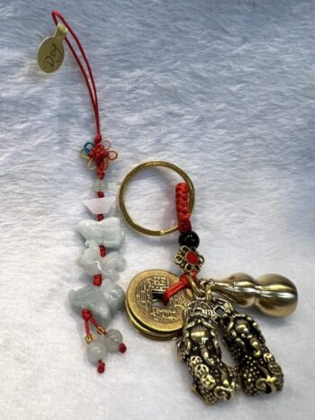 A key chain with some charms and beads on it