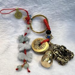 A key chain with some charms and beads on it