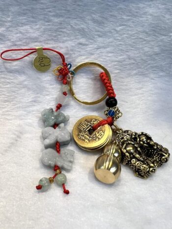 A key chain with some charms and beads on it