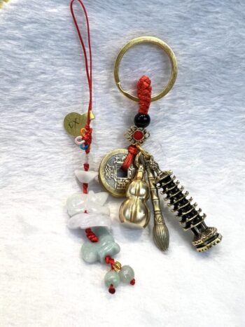 A key chain with various charms and beads.