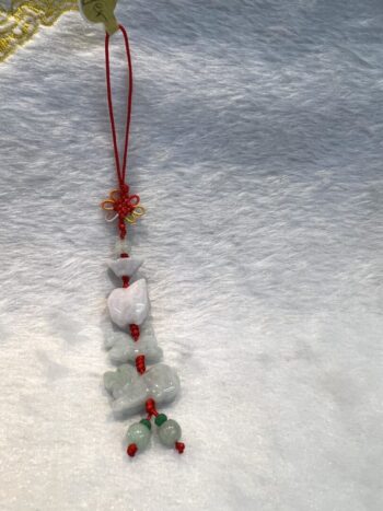 A red and white string of beads on the snow.