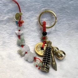 A key chain with various charms and beads.