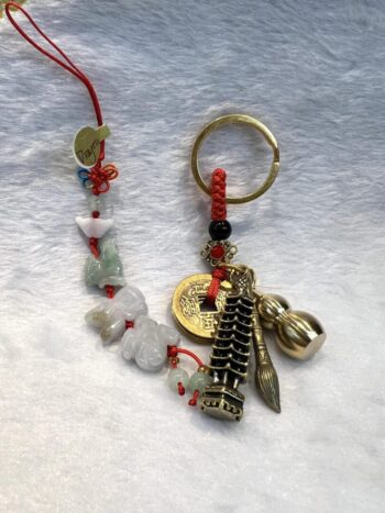 A key chain with various charms and beads.