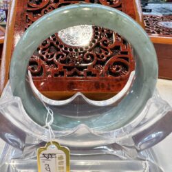 A close up of a green bangle on display