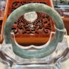 A close up of an open bangle on display