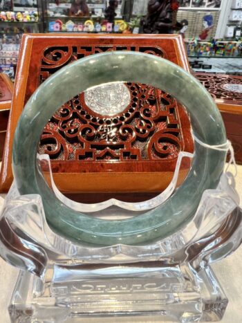 A close up of an open bangle on display