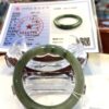 A green bracelet sitting on top of a table.