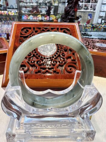 A close up of a glass ring on display