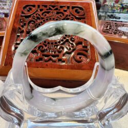 A close up of an asian style box with a glass bowl