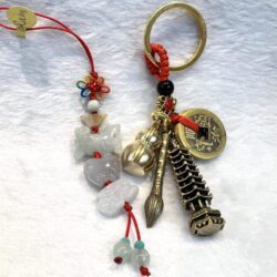 A key chain with various charms and beads.