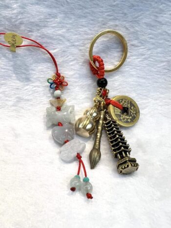 A key chain with various charms and beads.