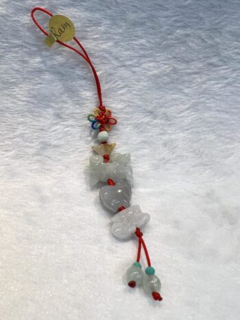 A string of beads with a bear and flowers on it.