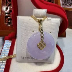 A necklace that is sitting on top of a box.