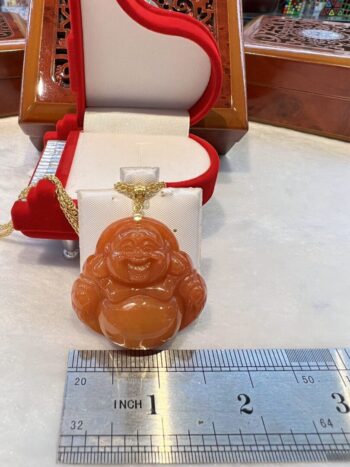 A small buddha statue sitting on top of a table.