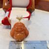 A small buddha statue sitting on top of a table.