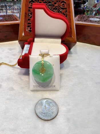 A green pendant sitting on top of a table.