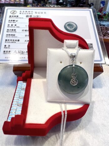 A necklace in its box on display.