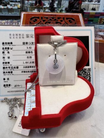 A necklace in a box on top of a table.