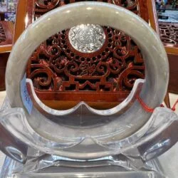 A close up of the inside of an asian style mirror.