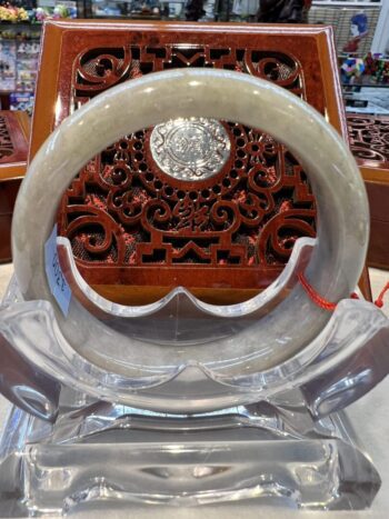 A close up of the inside of an asian style mirror.