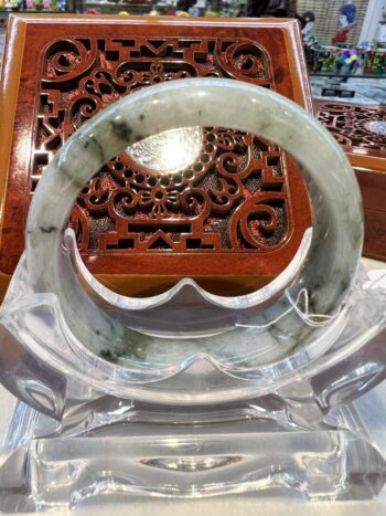 A close up of an asian style carved wooden box