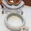 A white bangle sitting on top of a table.