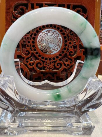 A green and white dish sitting on top of a table.