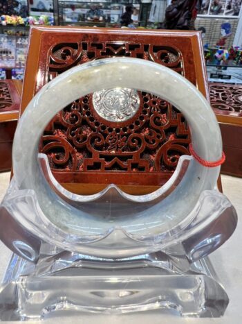 A large white stone ring sitting on top of a chair.