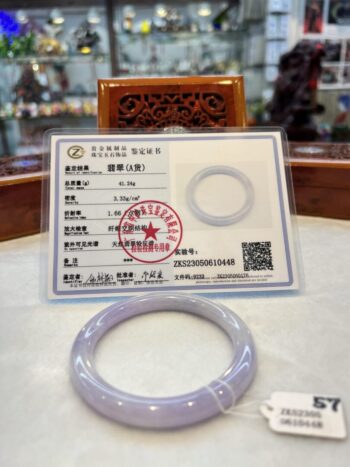 A white bracelet sitting on top of a table.