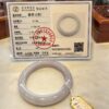 A certificate of authenticity and a bracelet