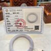 A picture of the certificate and the ring.