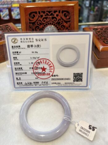 A picture of the certificate and the ring.