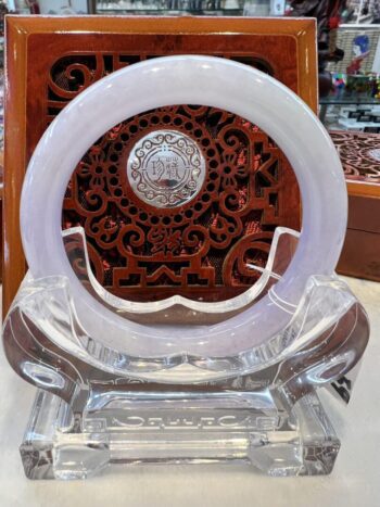 A white circular glass object sitting on top of a table.