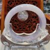 A clear glass object sitting on top of a wooden table.