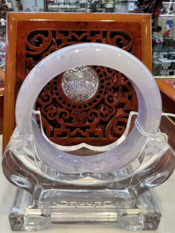 A clear glass object sitting on top of a wooden table.