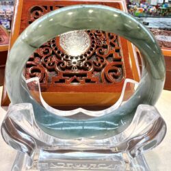 A close up of an asian style table with a glass bowl